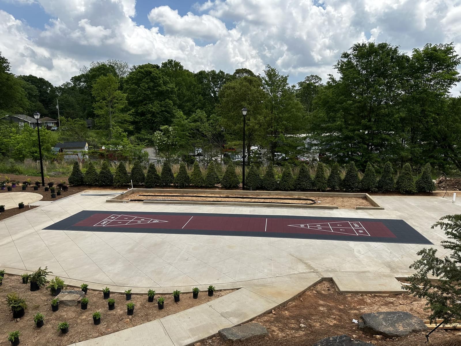 Outdoor shuffleboard courts at a community amenity space