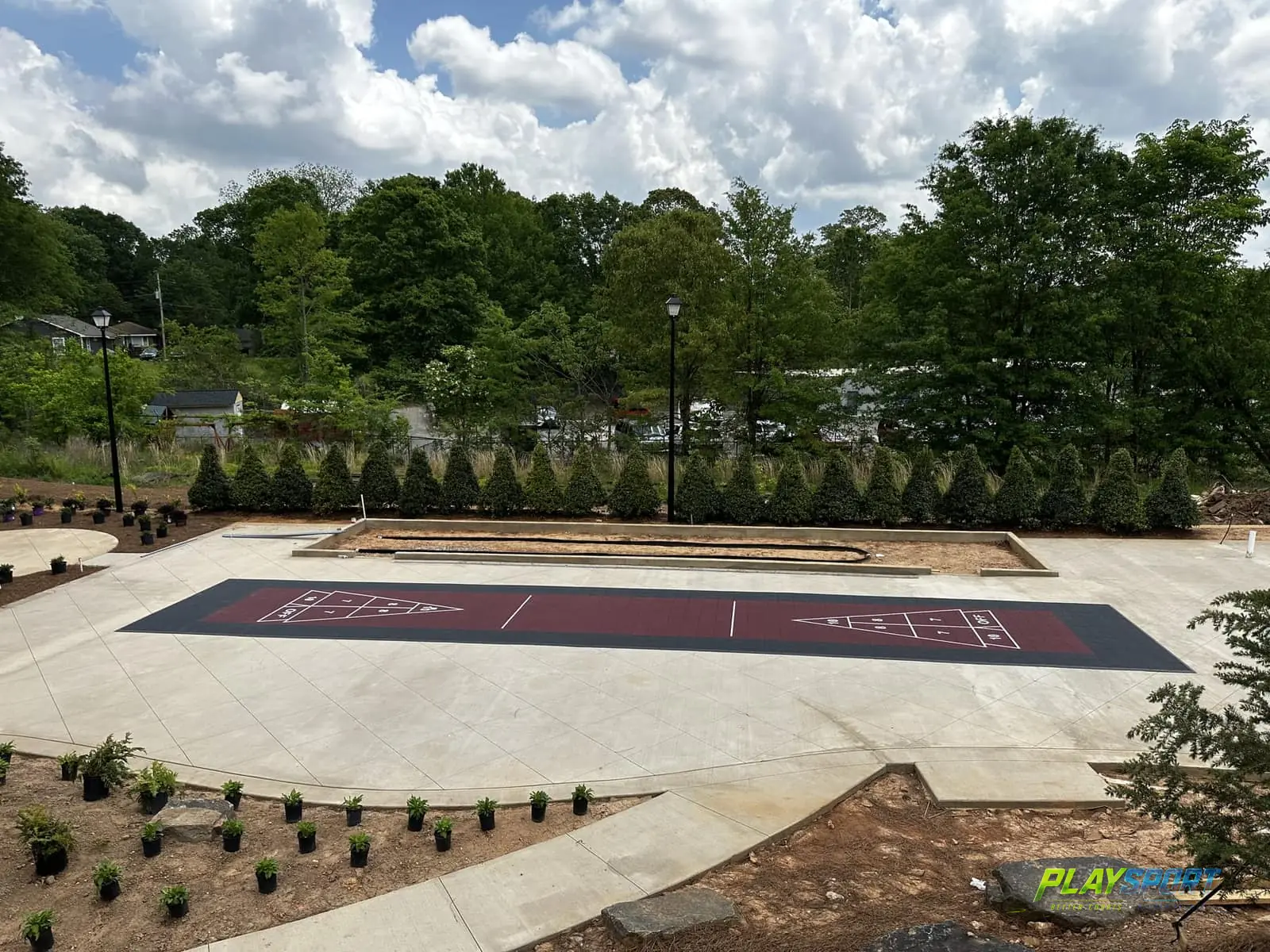 Outdoor modular shuffleboard courts at a community amenity space