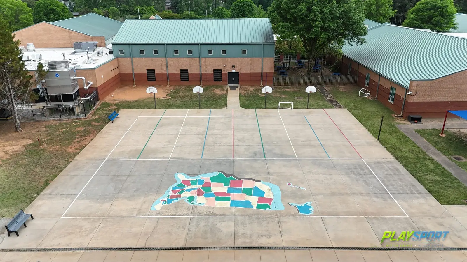 Aerial view of a worn school playground surface in Alpharetta GA before sports court resurfacing
