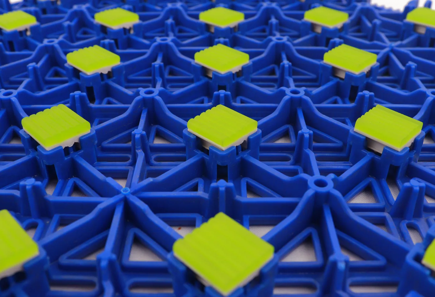 CORE tile underside — close-up of the shock-absorption pads
